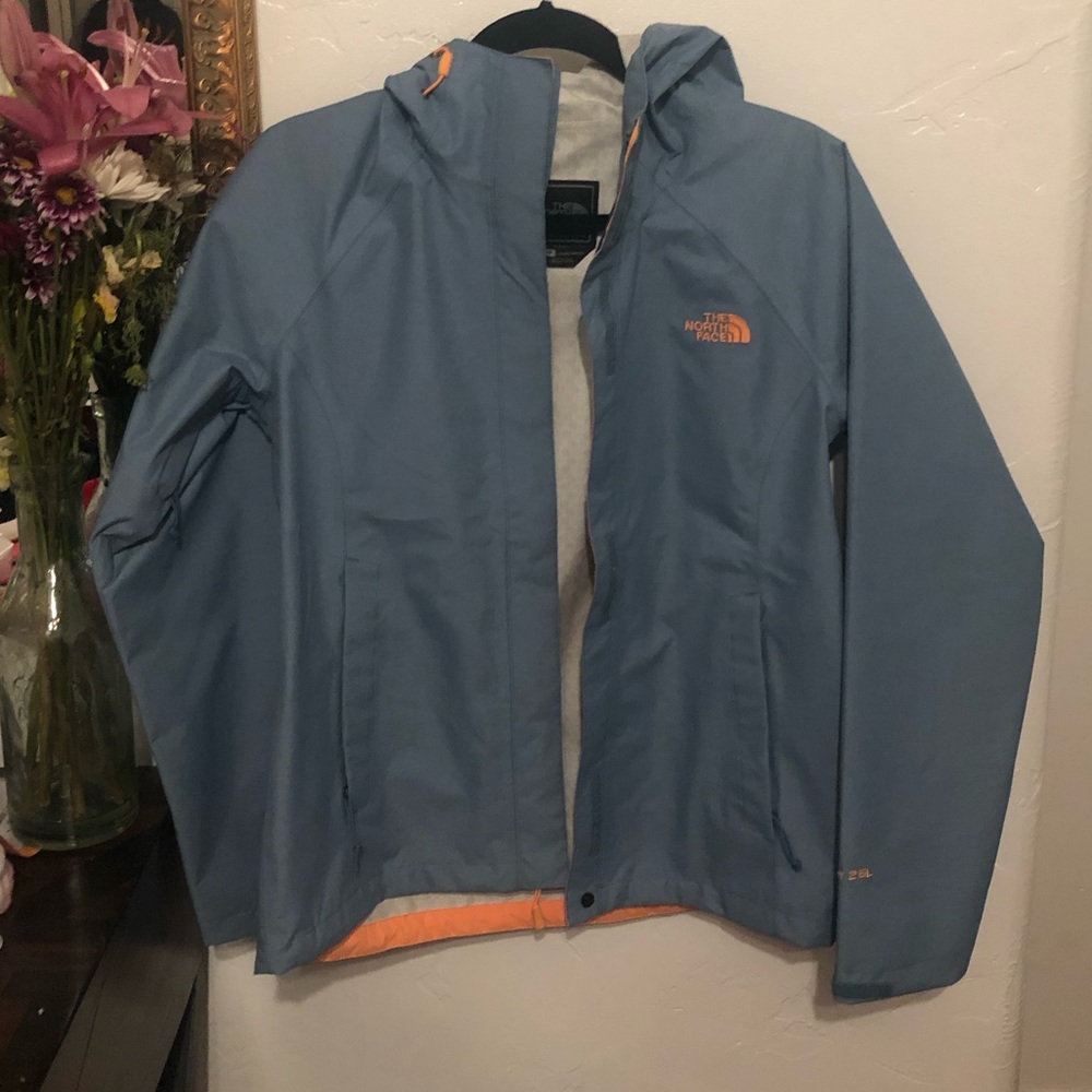 North face blue and orange rain jacket.